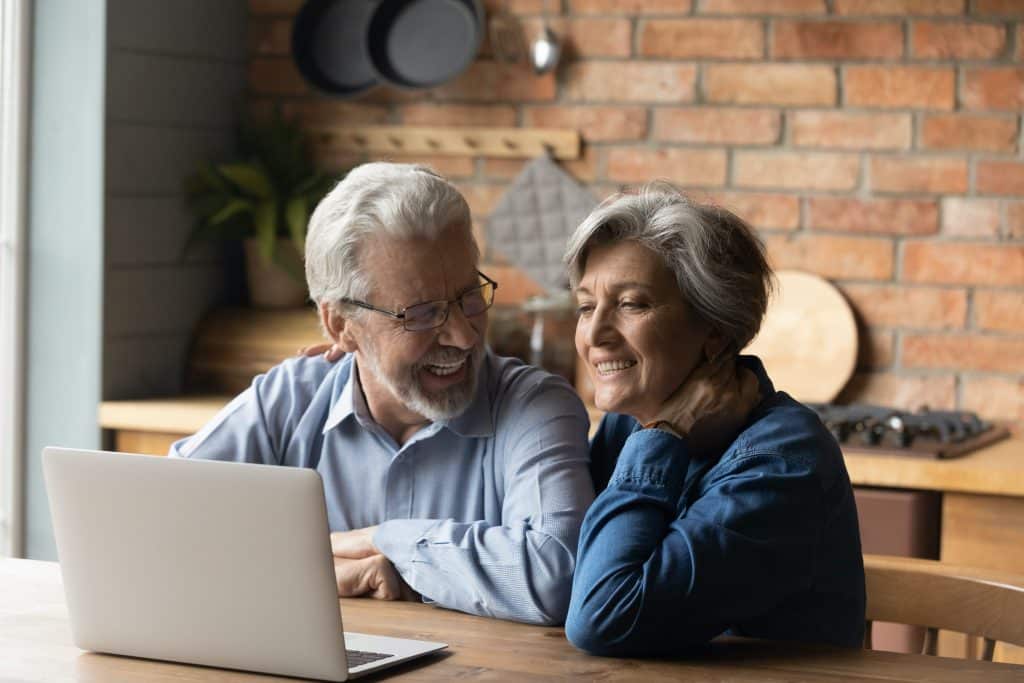 Retired family couple reviewing Equity Release lifetime Mortgage Deals